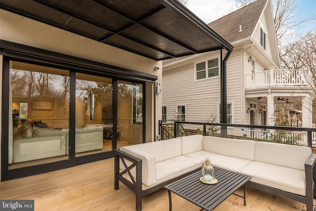 wooden deck with outdoor lounge area