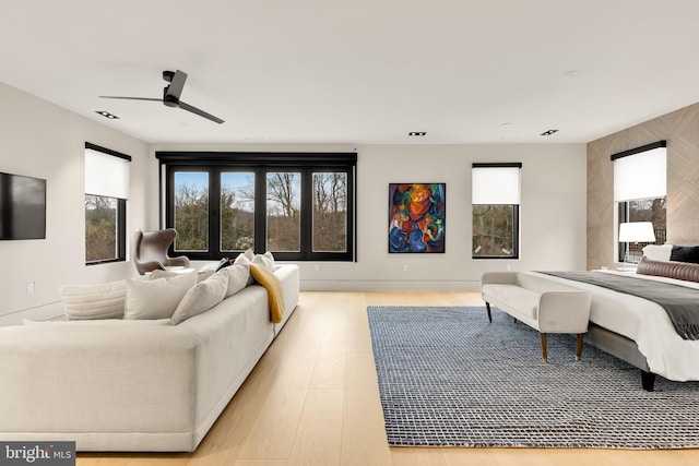 bedroom with wood finished floors and a ceiling fan