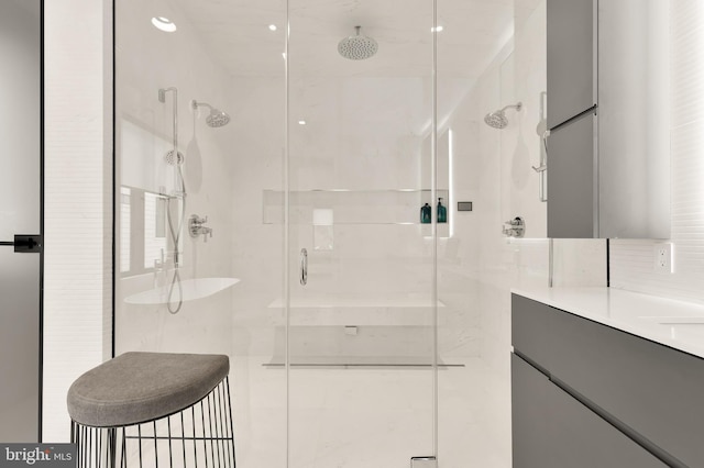bathroom featuring vanity and a shower stall