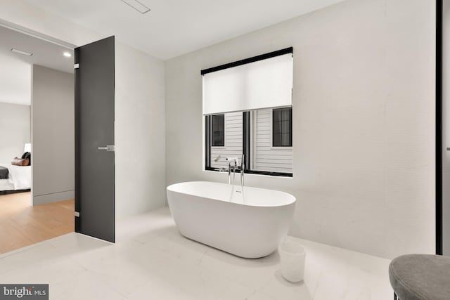 full bathroom featuring a soaking tub