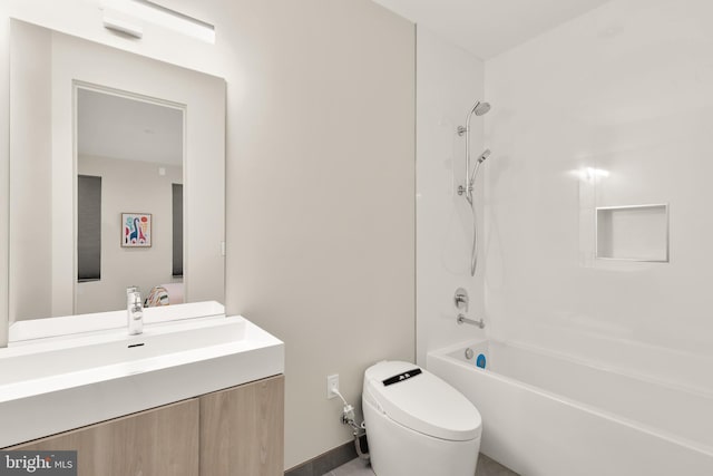 full bathroom with baseboards, shower / bath combination, vanity, and toilet