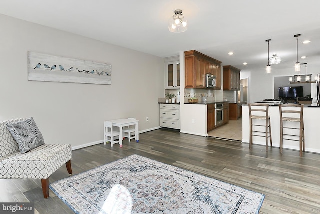 interior space with recessed lighting, baseboards, and wood finished floors