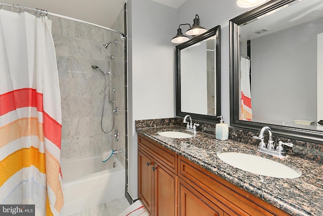 full bath with double vanity, visible vents, a sink, and shower / tub combo with curtain