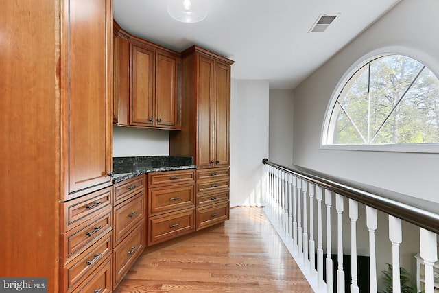 interior space featuring light wood-style flooring and visible vents