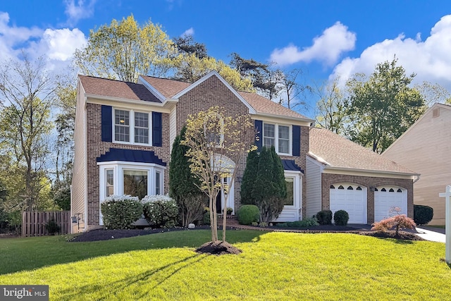 view of front facade featuring a garage, a front lawn, and brick siding