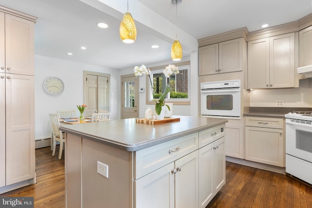kitchen with white appliances, recessed lighting, dark wood-style flooring, hanging light fixtures, and a baseboard radiator