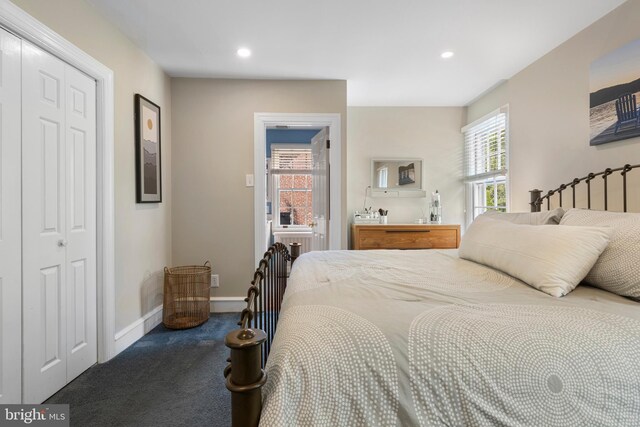 carpeted bedroom with baseboards, recessed lighting, and a closet