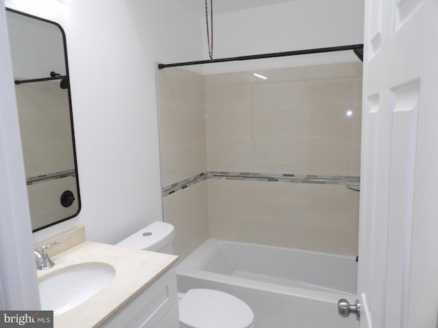bathroom featuring toilet, vanity, and  shower combination