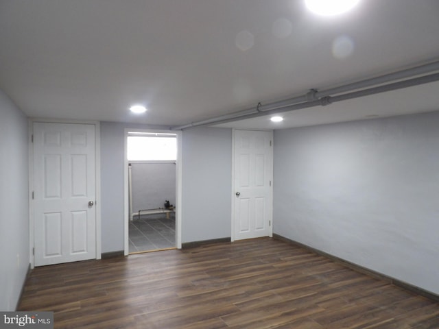 basement with wood finished floors and baseboards