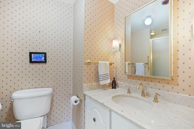 4200 Massachusetts Ave NW Unit 106, Washington, DC 20016 - full bathroom with wallpapered walls, toilet, vanity, and a stall shower