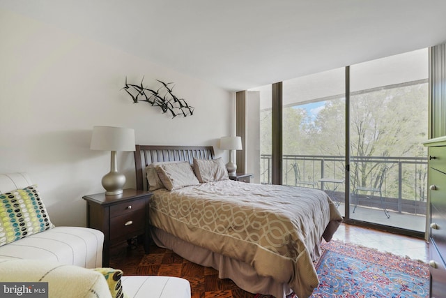 4200 Massachusetts Ave NW Unit 106, Washington, DC 20016 - bedroom with access to exterior and expansive windows