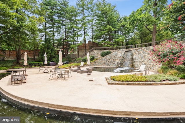 4200 Massachusetts Ave NW Unit 106, Washington, DC 20016 - view of home's community featuring a patio, a fenced backyard, and view of scattered trees