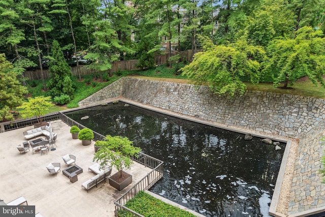 4200 Massachusetts Ave NW Unit 106, Washington, DC 20016 - view of swimming pool featuring a patio and an outdoor living space with a fire pit