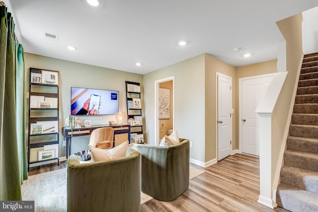 office space with recessed lighting, visible vents, light wood finished floors, and baseboards