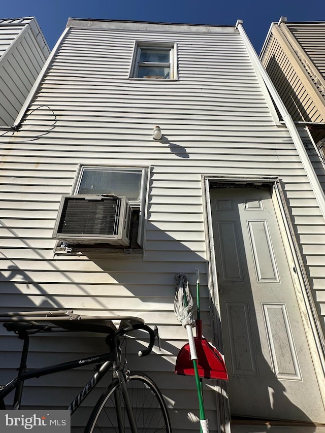 view of side of home with cooling unit
