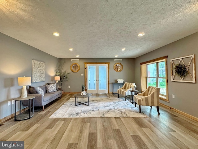 18855 Wicomico River Dr, Cobb Island, MD 20625 - sitting room featuring baseboards, wood finished floors, and a textured ceiling