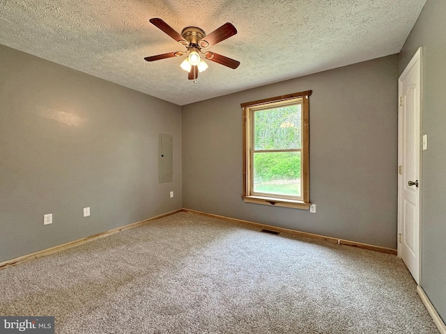 18855 Wicomico River Dr, Cobb Island, MD 20625 - empty room featuring a textured ceiling, visible vents, baseboards, a ceiling fan, and carpet floors