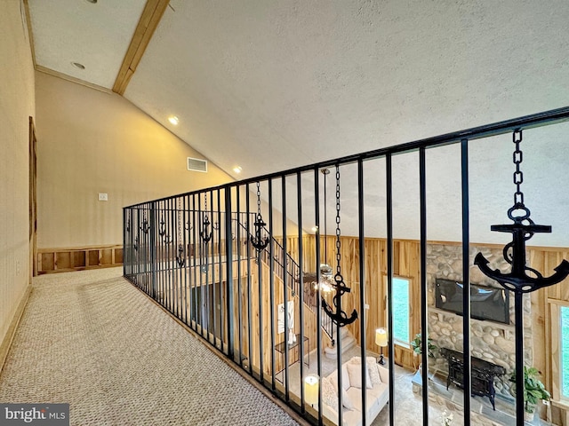 18855 Wicomico River Dr, Cobb Island, MD 20625 - corridor with carpet flooring, a textured ceiling, visible vents, recessed lighting, and high vaulted ceiling