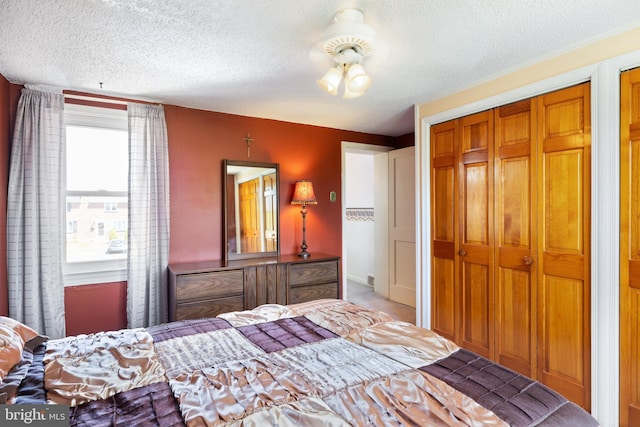 carpeted bedroom with a textured ceiling
