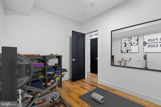 1169 Neal St NE Unit 1, Washington, DC 20002 - workout area with baseboards and wood finished floors