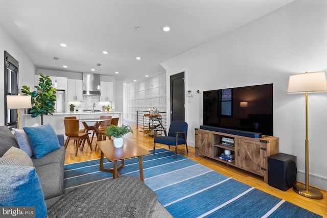 1169 Neal St NE Unit 1, Washington, DC 20002 - living room with recessed lighting, baseboards, and light wood-style floors