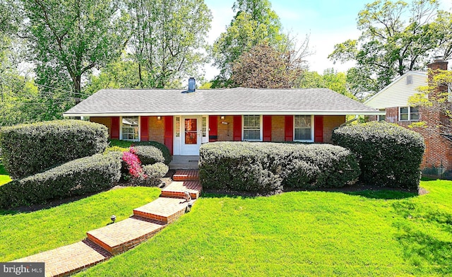 single story home with brick siding, covered porch, and a front yard