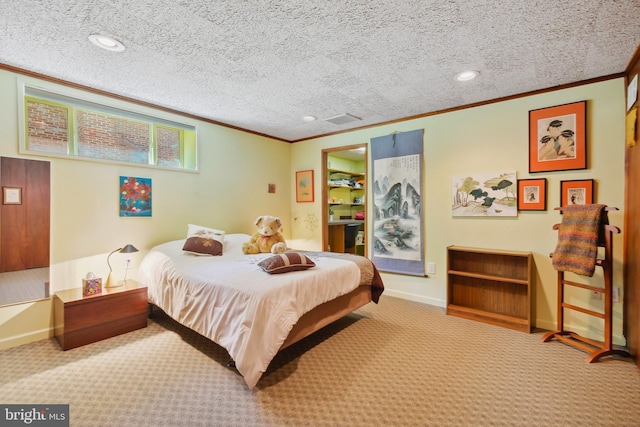 carpeted bedroom with crown molding, a textured ceiling, baseboards, and visible vents