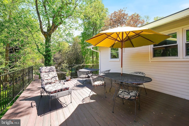wooden deck with outdoor dining area
