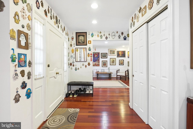 hallway with recessed lighting and dark wood-type flooring