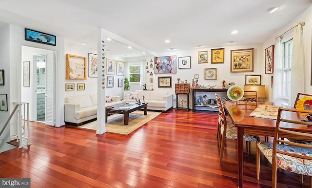 dining room with wood-type flooring and recessed lighting
