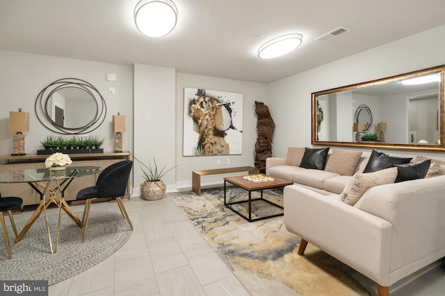 living room featuring visible vents and baseboards