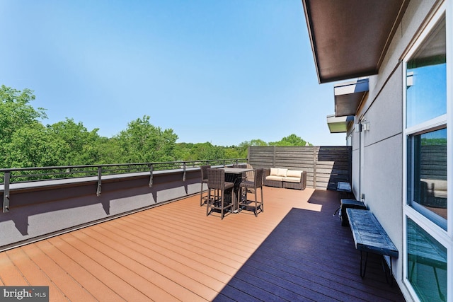 wooden deck with outdoor lounge area