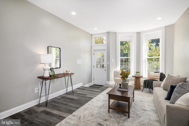 living room with recessed lighting, wood finished floors, and baseboards