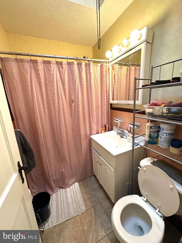 3525 Hartel Ave, Philadelphia, PA 19136 - bathroom featuring a shower with shower curtain, a textured ceiling, toilet, and vanity