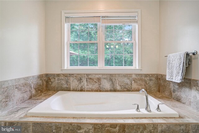bathroom with a garden tub