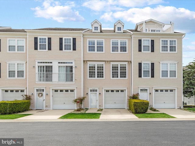 view of front of home with driveway and an attached garage