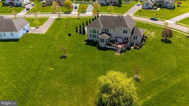 birds eye view of property with a residential view