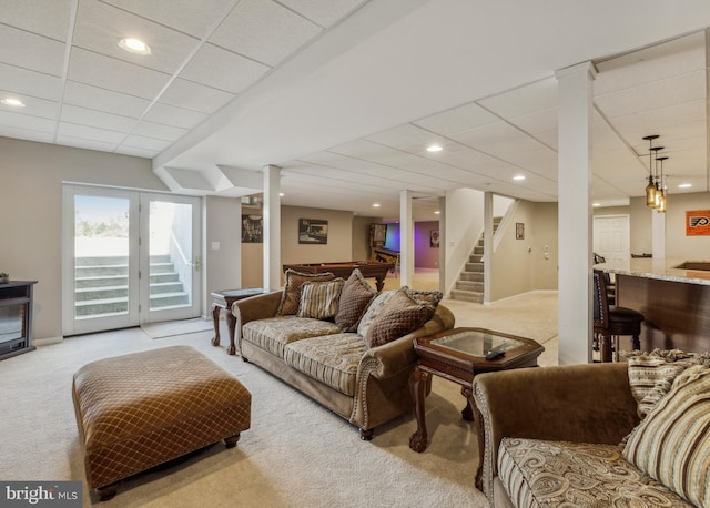 living room featuring pool table, light colored carpet, a drop ceiling, and stairway