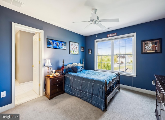 bedroom with baseboards, ceiling fan, carpet flooring, and visible vents