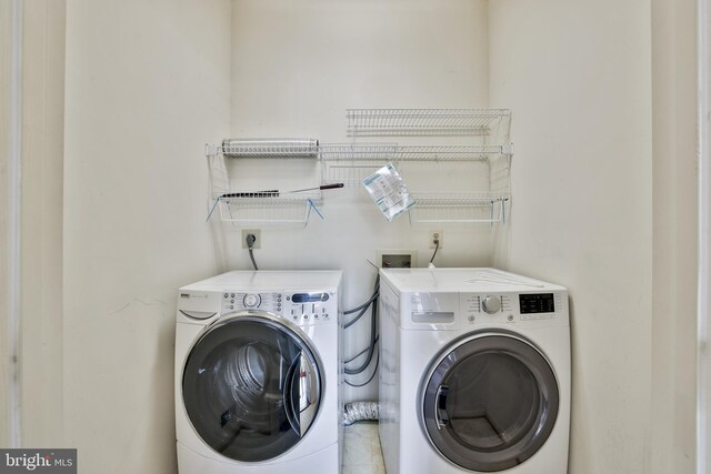 laundry room with washer and dryer and laundry area