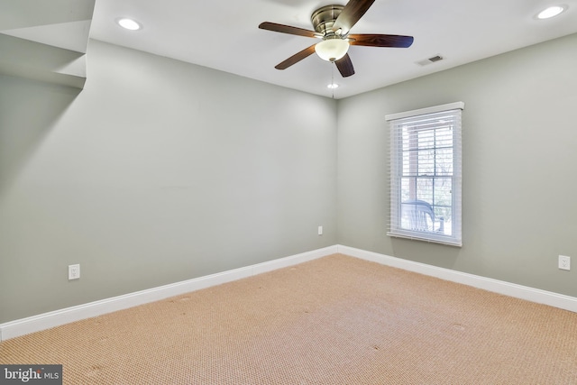 carpeted spare room featuring baseboards, visible vents, recessed lighting, and ceiling fan