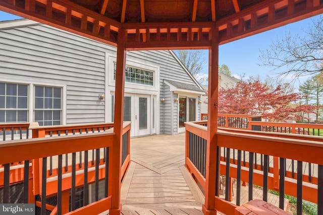 deck with a gazebo and french doors