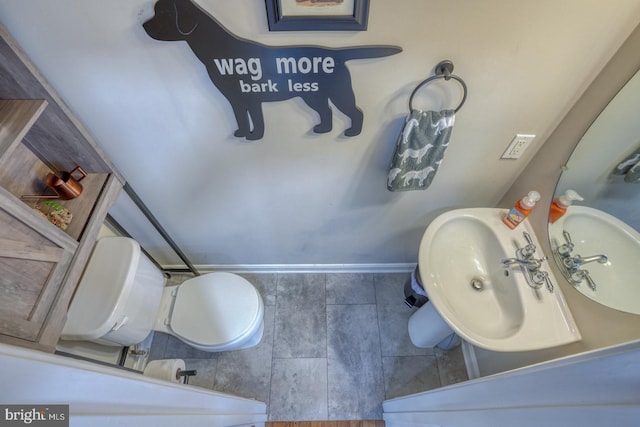 341 Creekside Commons Ct, Stevensville, MD 21666 - bathroom featuring a sink, toilet, baseboards, and tile patterned floors