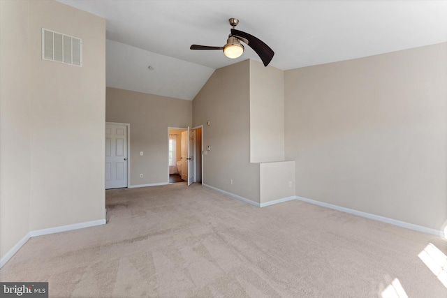 spare room featuring ceiling fan, carpet, baseboards, vaulted ceiling, and visible vents