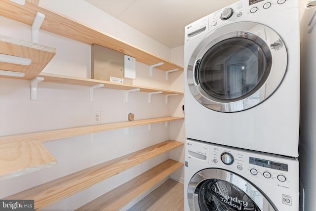 laundry area featuring laundry area and stacked washer and dryer