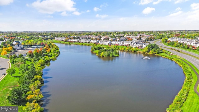 birds eye view of property with a residential view and a water view