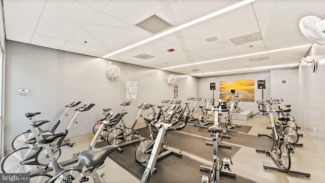 gym with visible vents and a paneled ceiling