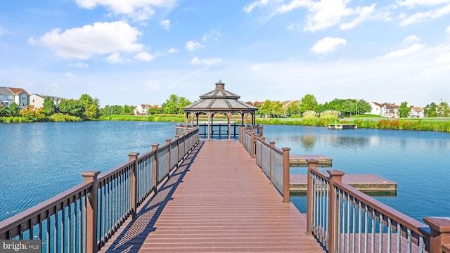dock area with a water view and a gazebo