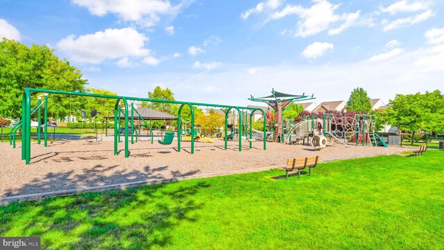 community playground featuring a lawn