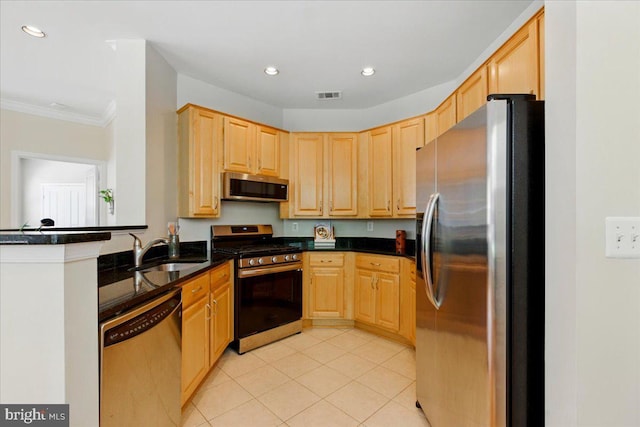 12000 Market St Unit 189, Reston, VA 20190 - kitchen with appliances with stainless steel finishes, visible vents, light brown cabinetry, and a sink